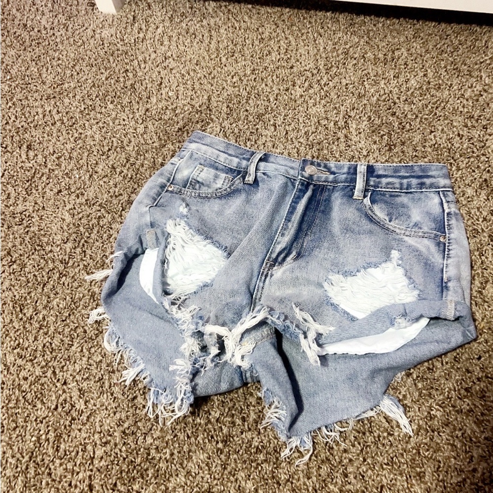 3 different pairs of SHEIN jean shorts.